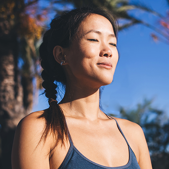 Asian woman meditating